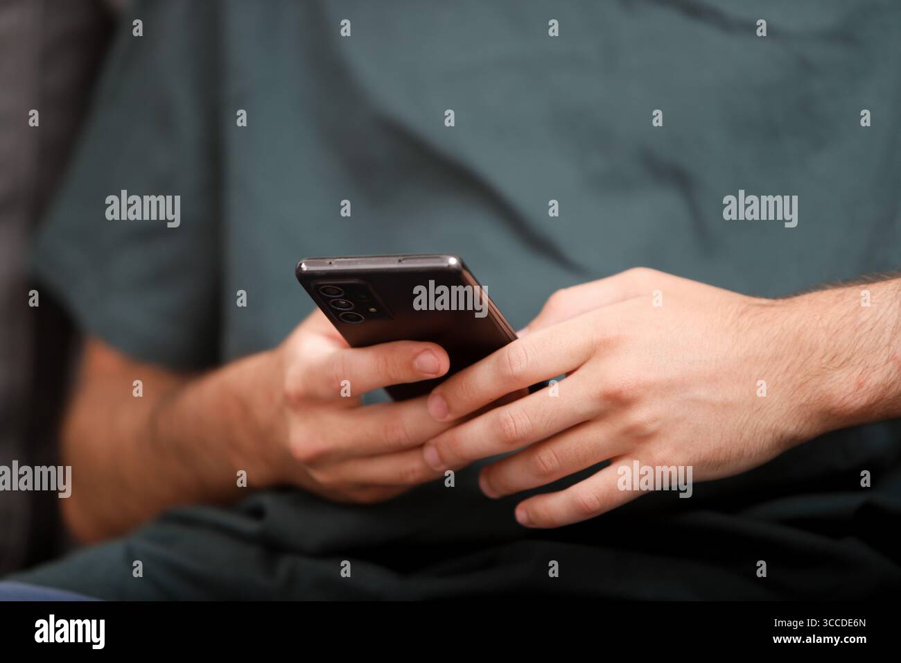 Close-up of man using smartphone, browsing internet, mobile phone, modern technology Stock Photo