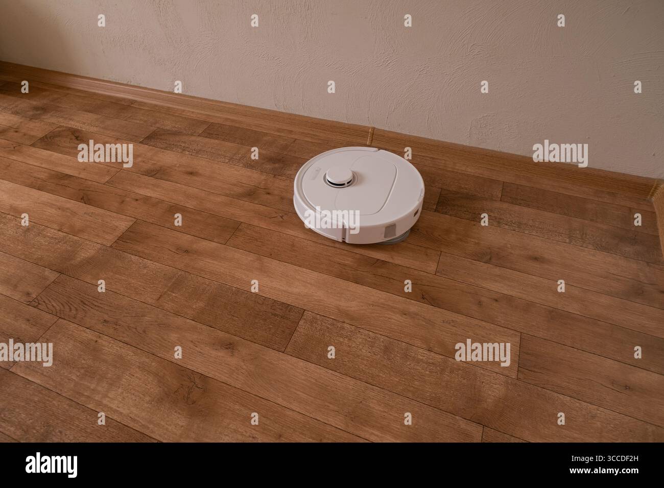 Robot maintains cleanliness without human involvement for effortless and automatic home cleaning every day Stock Photo