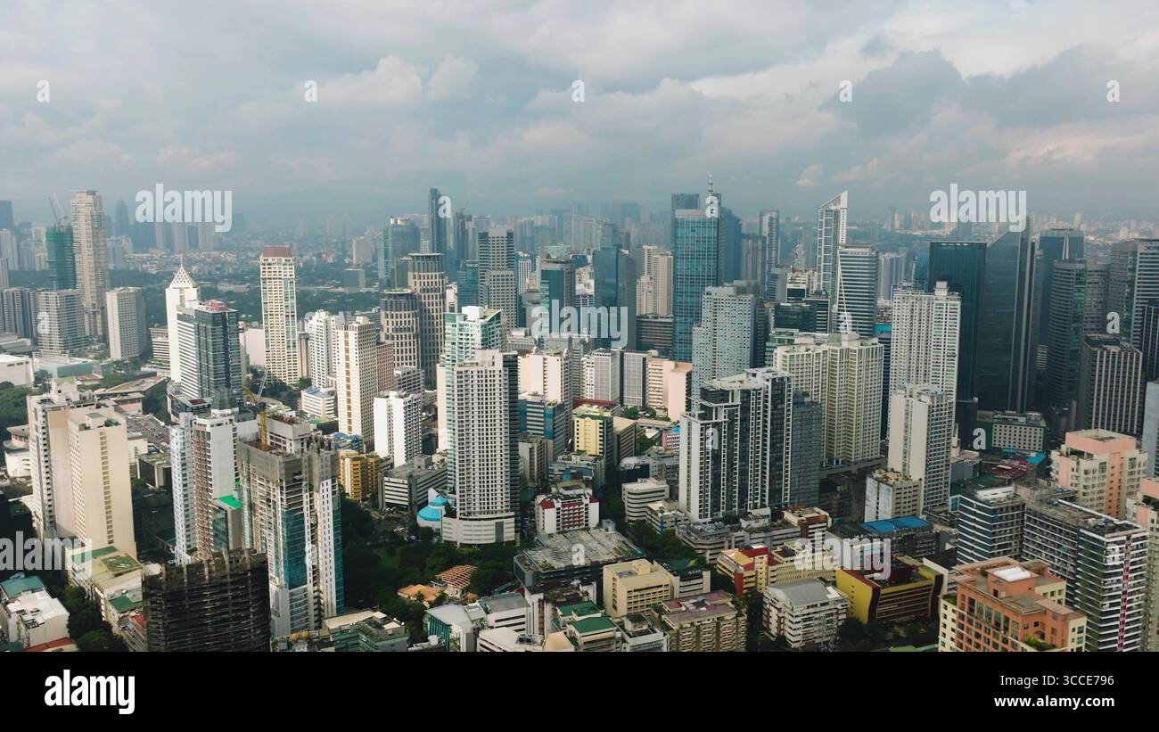 View of high rise buildings in a dense modern city with clear skies and ...
