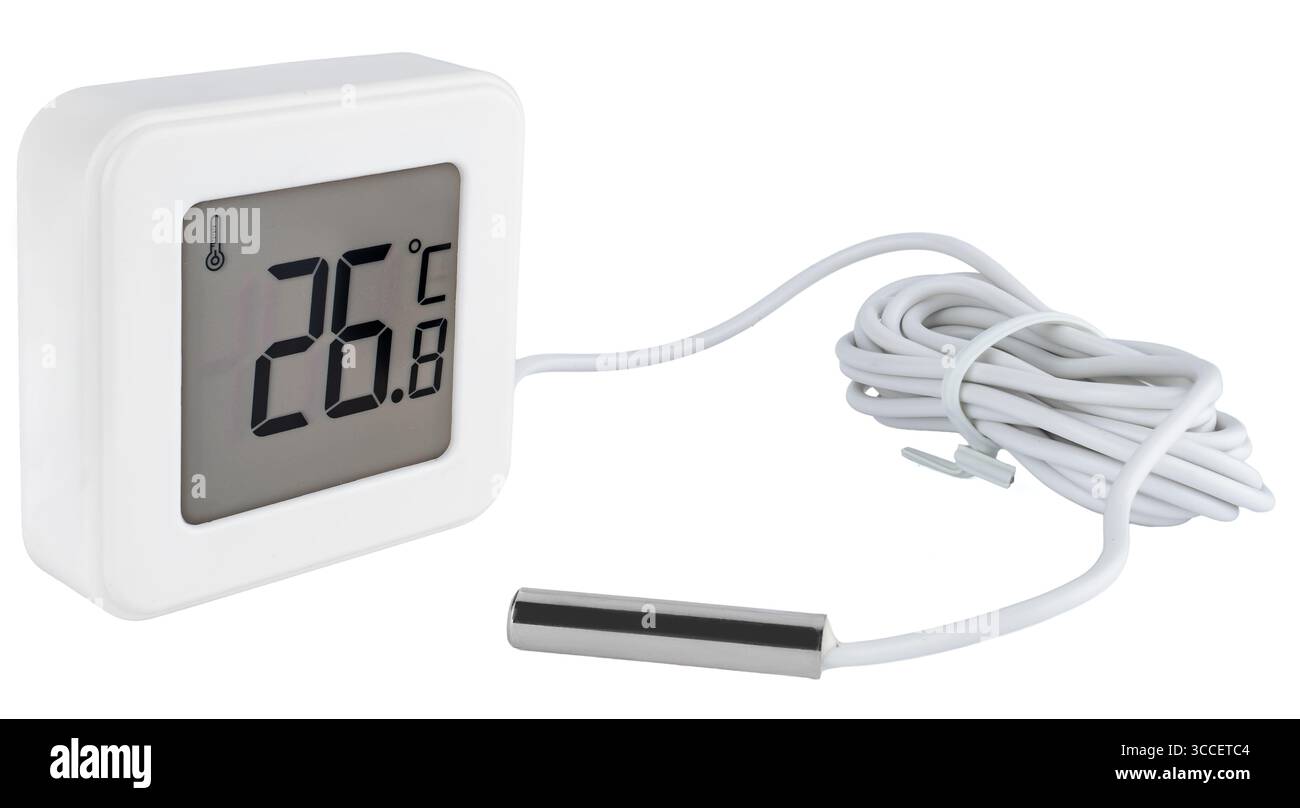 Electronic thermometer with temperature probe for measuring indoor and outdoor temperatures, on a white background in insulation. Convenient for home Stock Photo