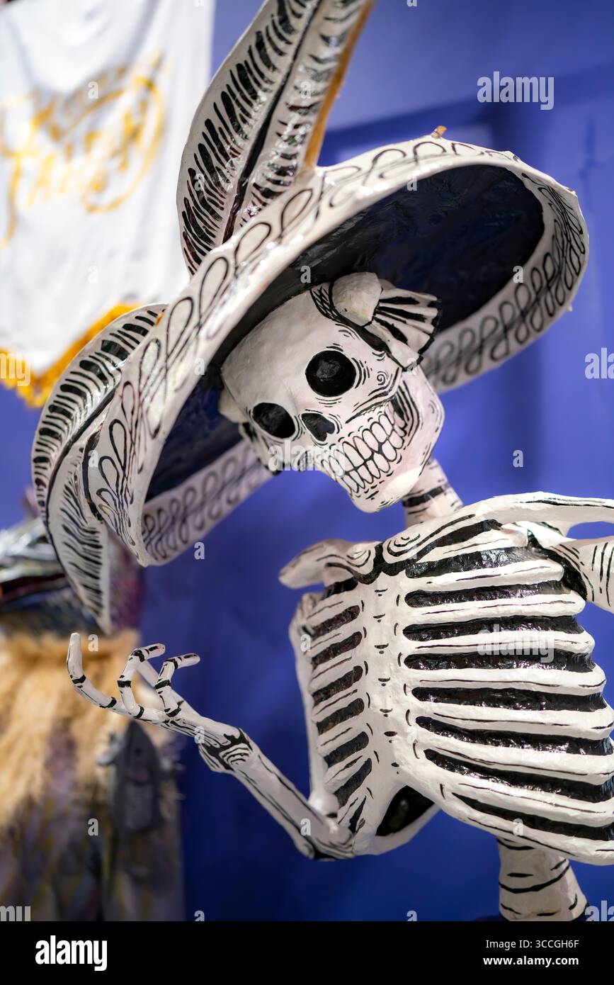 Mexico City, Mexico - November 3, 2024: Close-up of a Catrina skeleton sculpture dressed in a traditional hat, displayed for Day of the Dead at the Mu Stock Photo