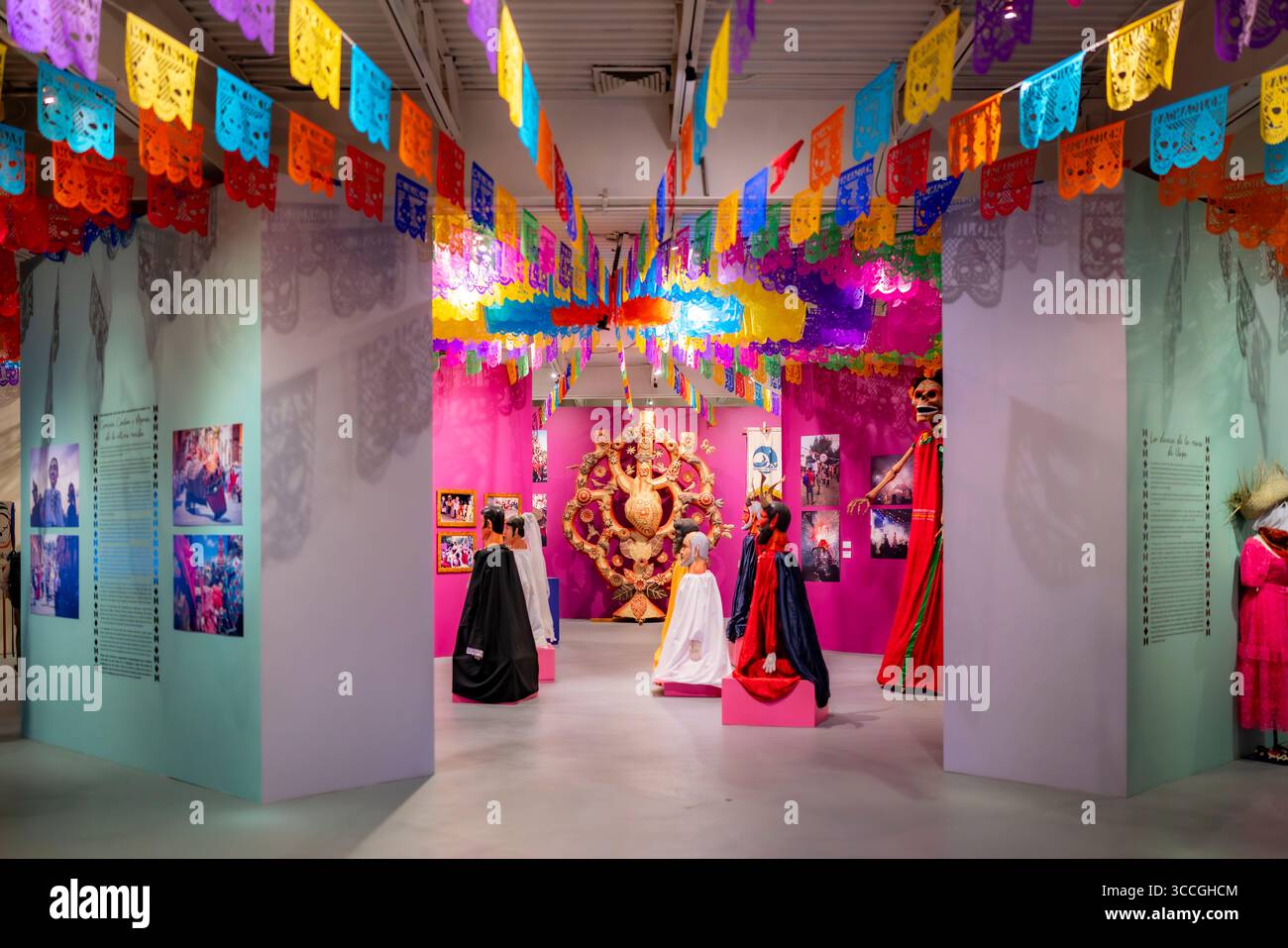 Mexico City, Mexico - November 3, 2024: Vibrant Day of the Dead exhibit with papel picado banners, sculptures, and decorations at the Museum of Popula Stock Photo