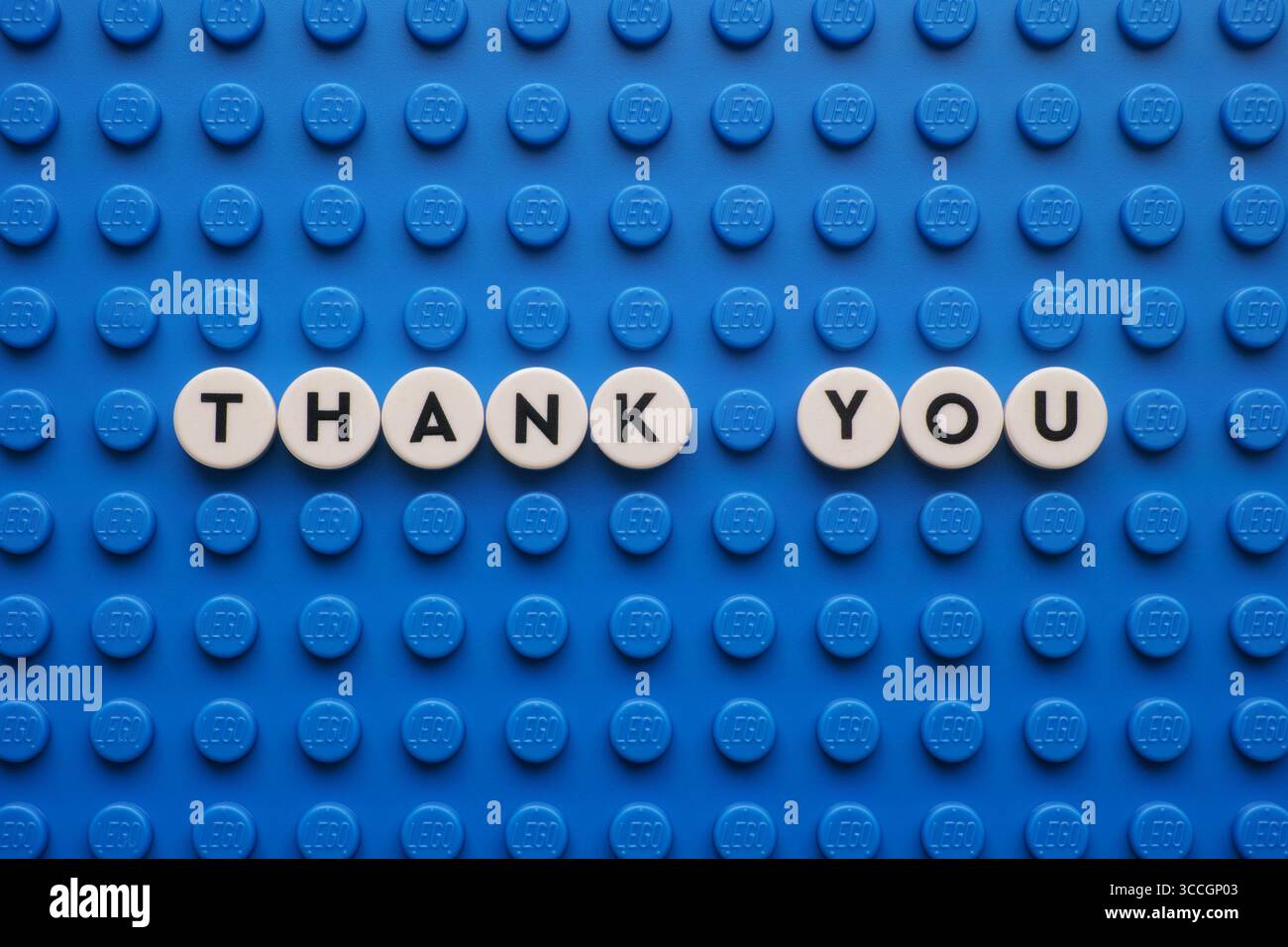Tambov, Russian Federation - August 11, 2025  The appreciation phrase Thank You on a blue Lego baseplate. The scene is made out of Lego dots. Stock Photo