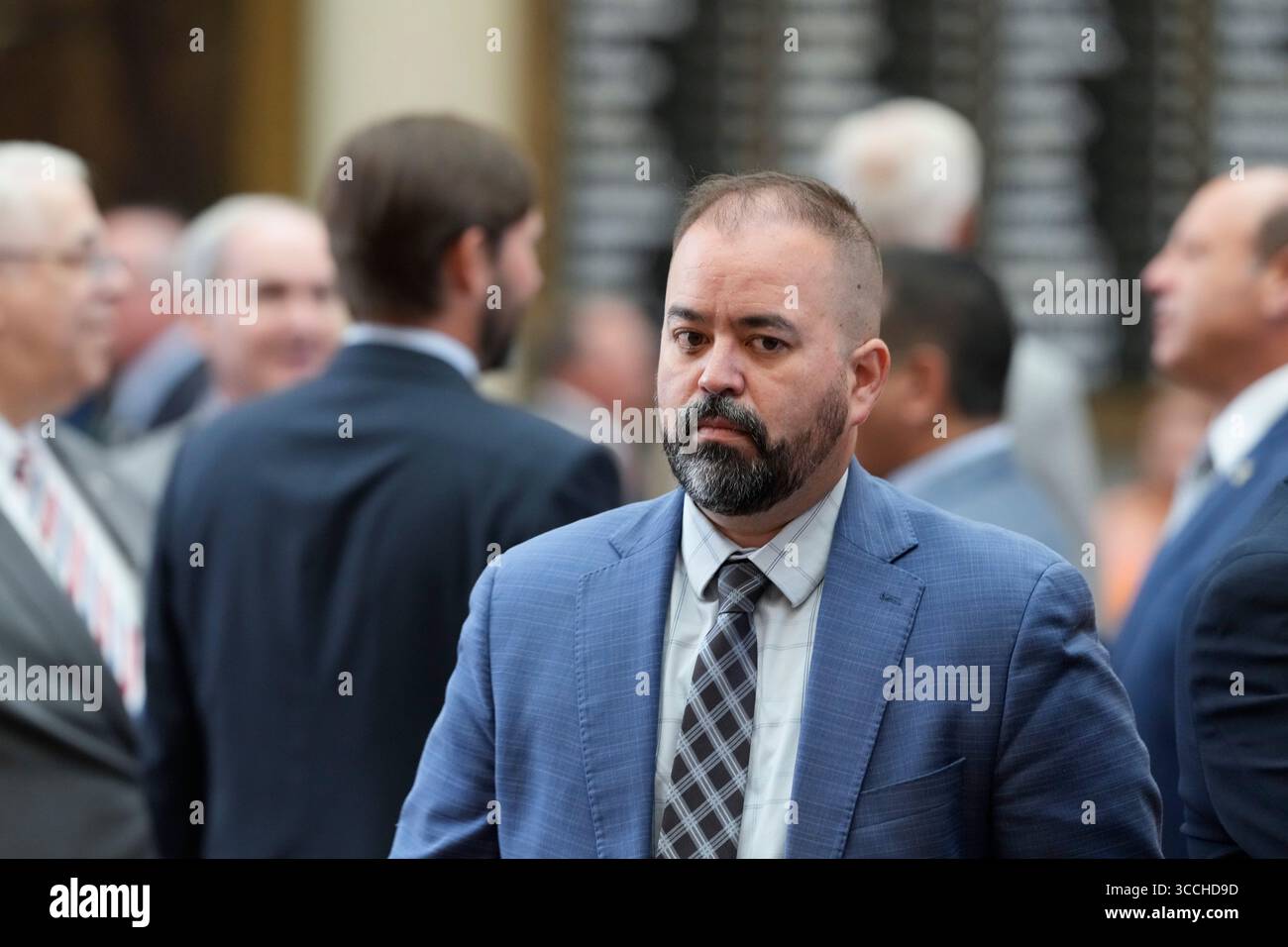 Austin, United States. 11th Aug, 2025. Democratic State Rep.JOE MOODY, D-El Paso, walks to his seat as Texas House of Representatives members make a failed attempt to establish a quorum on the eighth day of a Democratic walkout over a Republican mid-decade congressional redistricting attempt. The measure would potentially give U.S. President Donald Trump five more votes in Congress. Credit: Bob Daemmrich/Alamy Live News Stock Photo