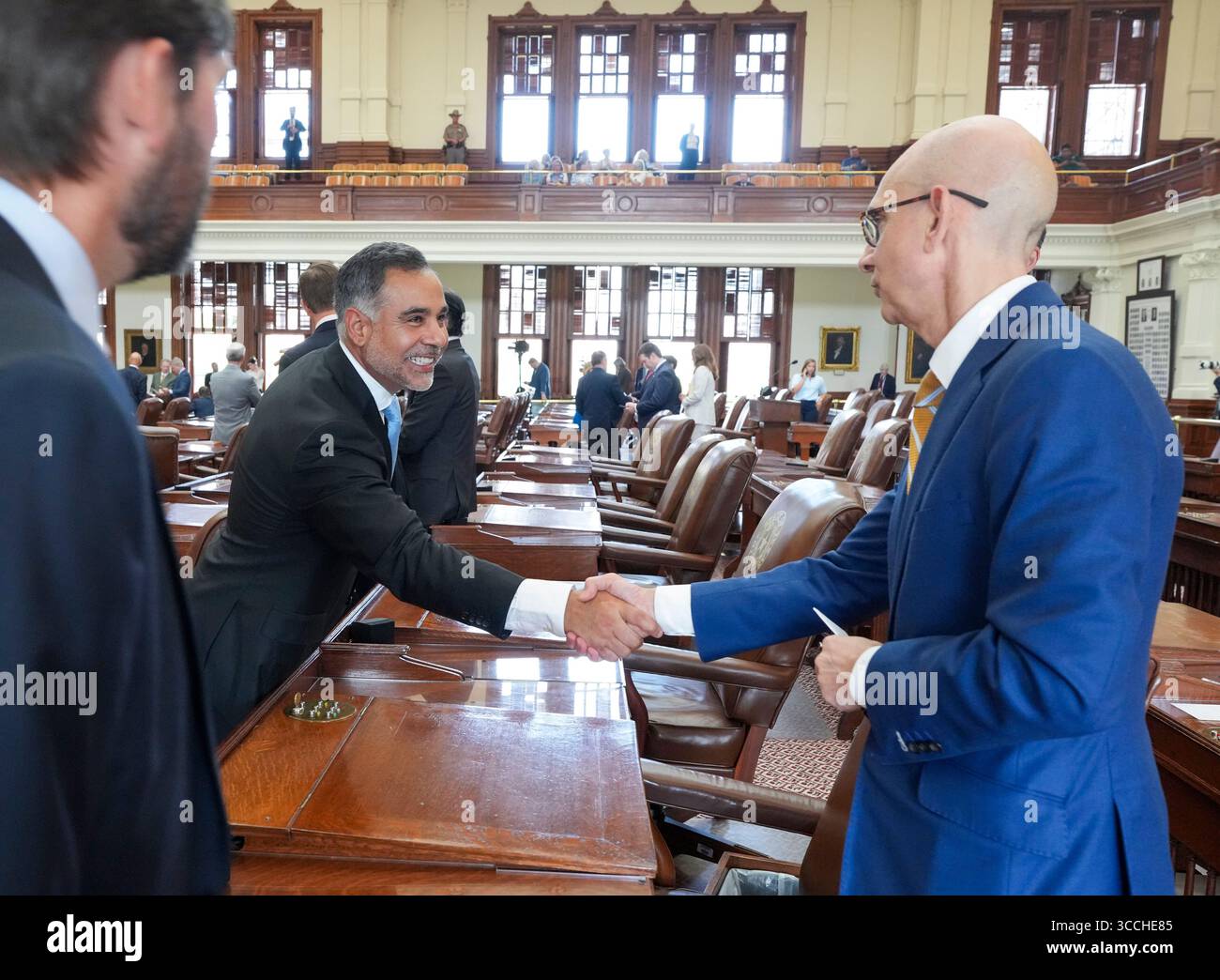 Austin, United States. 11th Aug, 2025. Democratic State Rep. EDDIE MORALES, JR. D-Eagle Pass, l, shakes hands with Rep. GREG BONNEN, MD, R-Friendswood, as the Texas House of Representatives members make a failed attempt to establish a quorum on the eighth day of a Democratic walkout over a Republican mid-decade congressional redistricting attempt. The measure would potentially give U.S. President Donald Trump five more votes in Congress. Credit: Bob Daemmrich/Alamy Live News Stock Photo