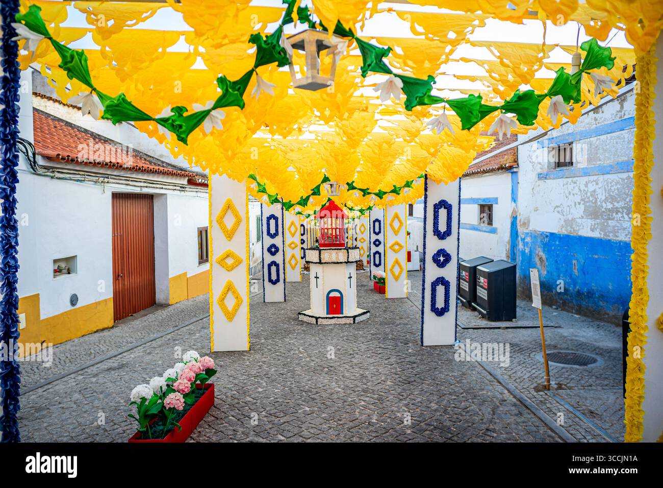 Lighthouse in the decorated streets and visitors at the paper flower festival organized by the town of Redondo-Évora-Portugal Stock Photo