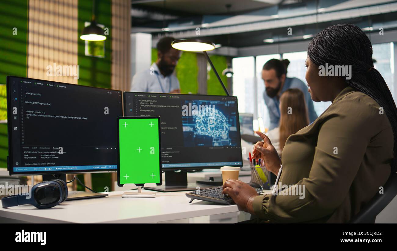 Admin writing code on isolated screen tablet, developing machine learning APIs. IT specialist using chroma key device to troubleshoot software errors using artificial intelligence, camera A Stock Photo