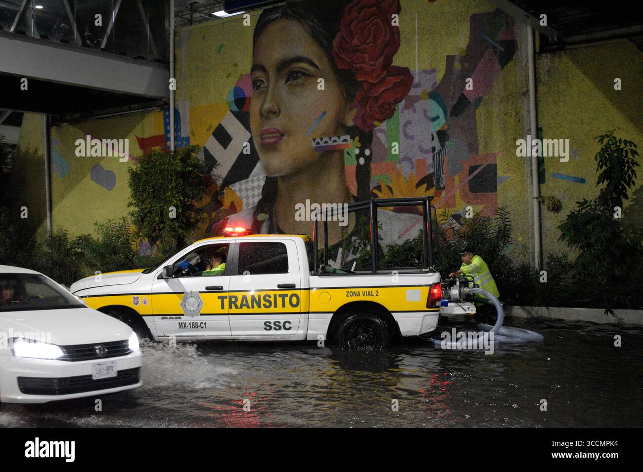 Traffic police officers dredging flooded streets due the streets were ...