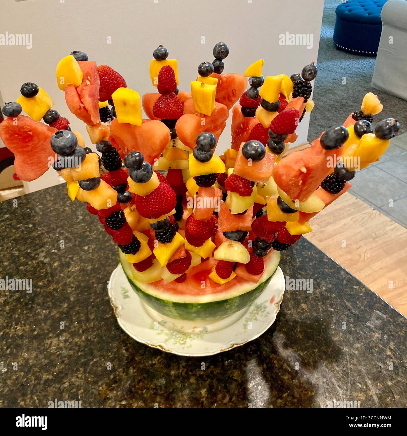A handmade arrangement of pieces of fresh fruit makes an interesting centerpiece. Stock Photo