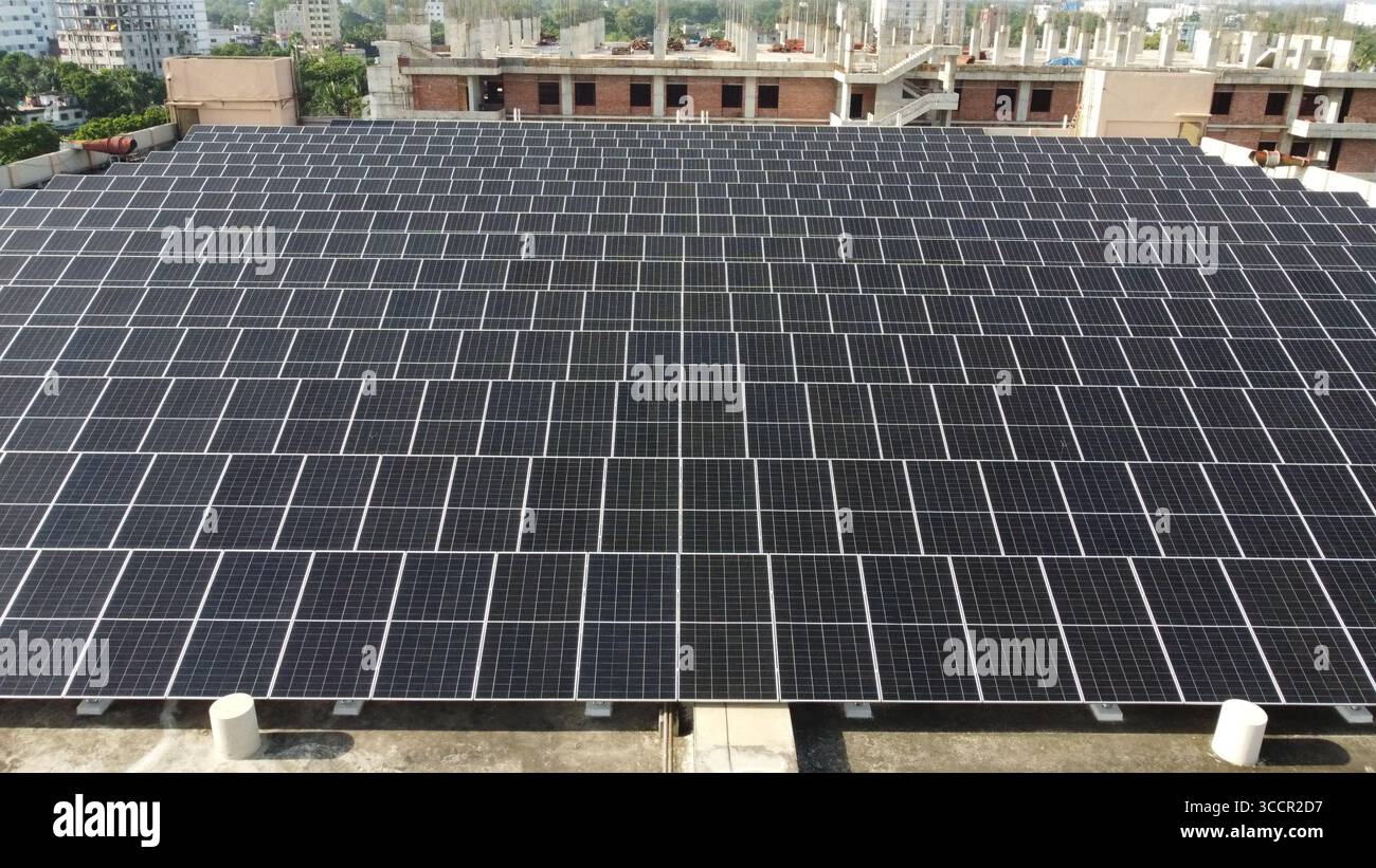 Industrial rooftop solar array powering factory operations - renewable ...