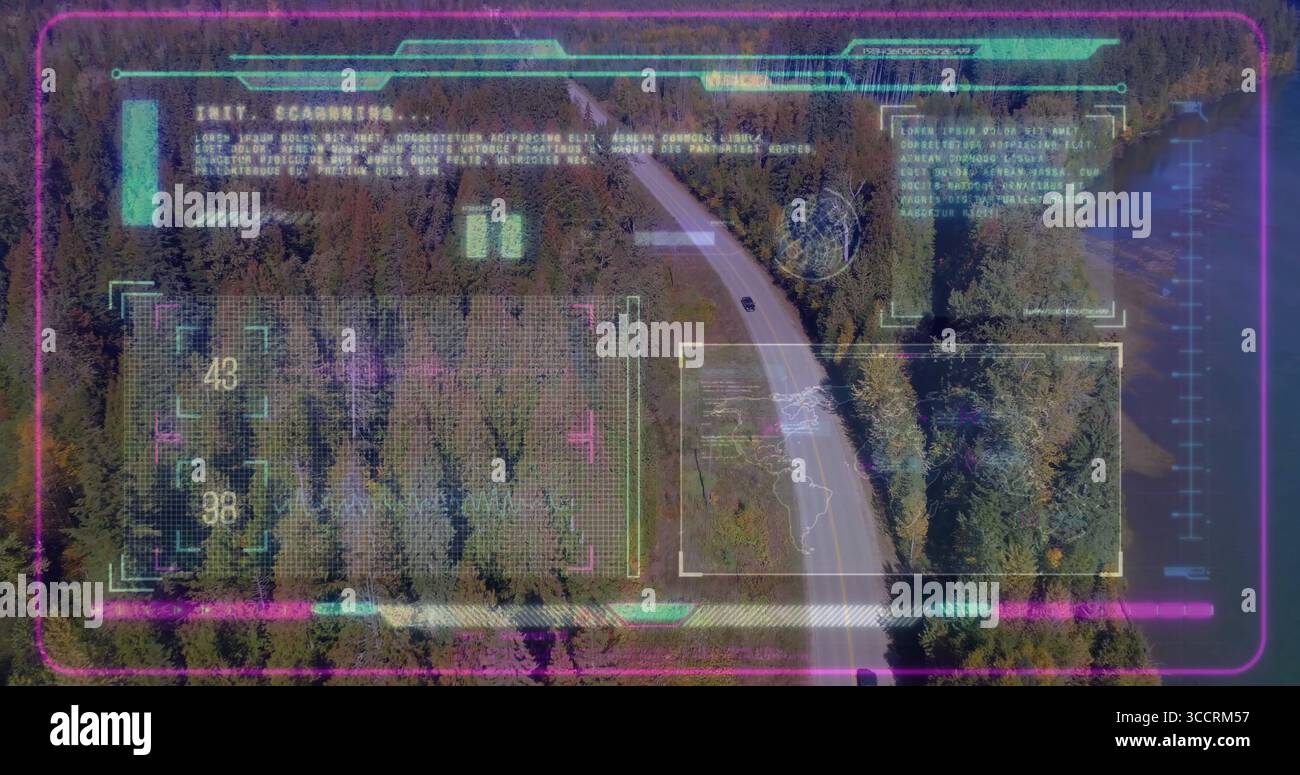 Scanning winding two-lane road through conifer forest from above, with neon holographic overlays Stock Photo