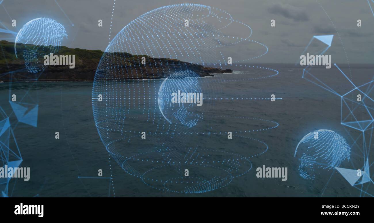 Projecting central holographic globe over coastal shoreline, with mesh network and arrow graphics Stock Photo