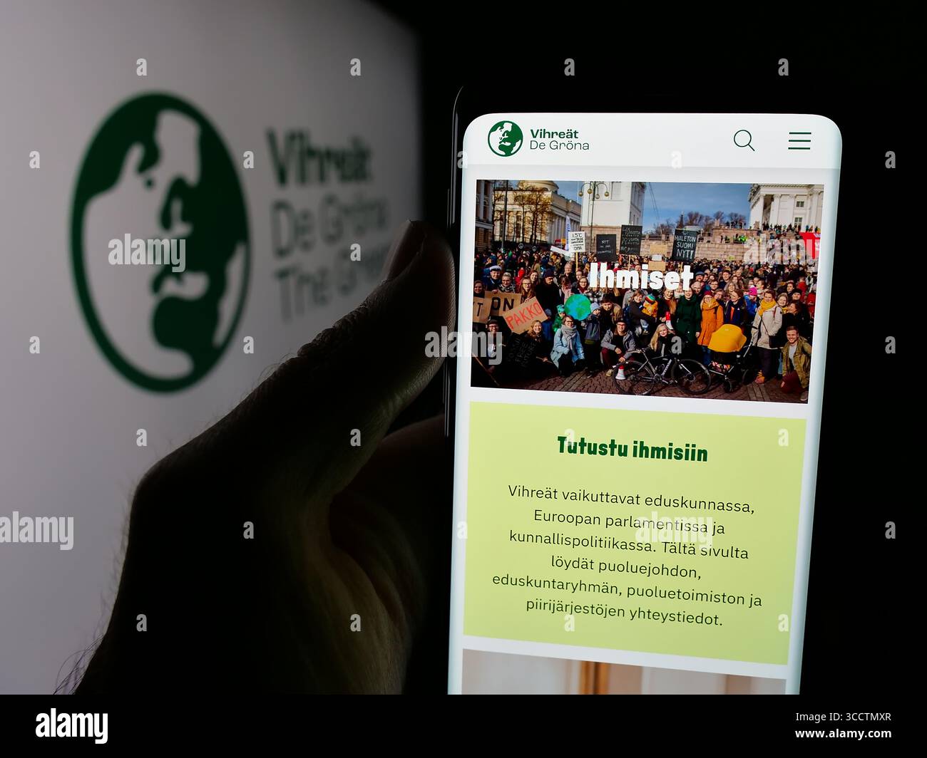 Germany. 25th July, 2025. In this photo illustration, a person is holding a smartphone with the webpage of Finnish political party Vihrea Liitto (Vihreat) on screen in front of logo. (Credit Image: © Timon Schneider/SOPA Images via ZUMA Press Wire) EDITORIAL USAGE ONLY! Not for Commercial USAGE! Stock Photo