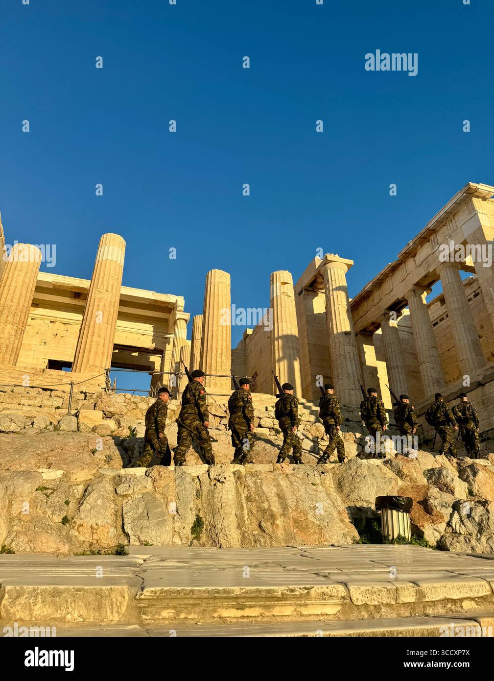 The Greek military conducts a ceremony at sunset to inspect the interior of the Acropolis and guard the flag, an important cultural tradition. - Smartphone Captured Stock Image