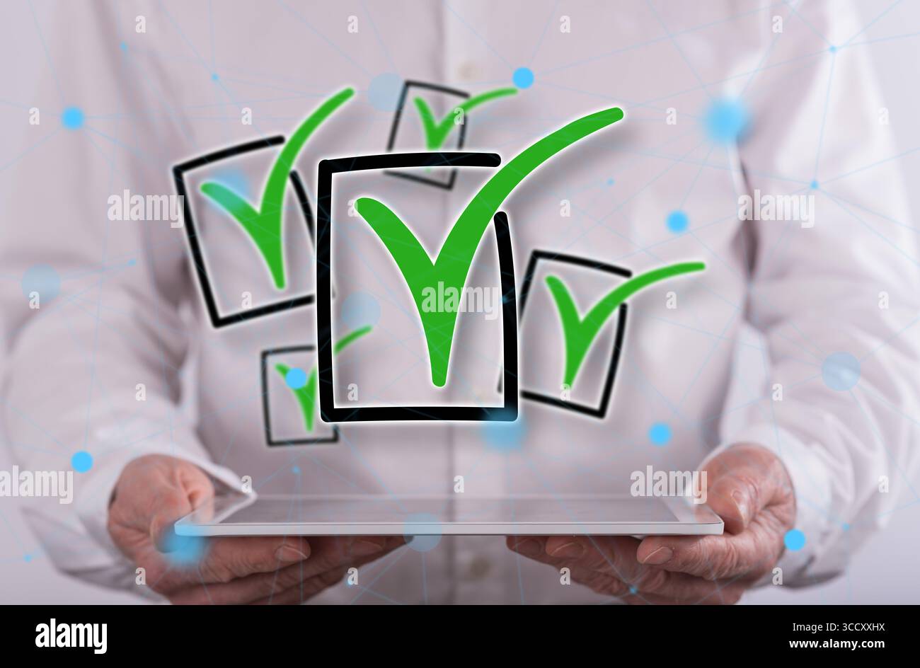 Validation concept above a tablet held by a man in background Stock Photo
