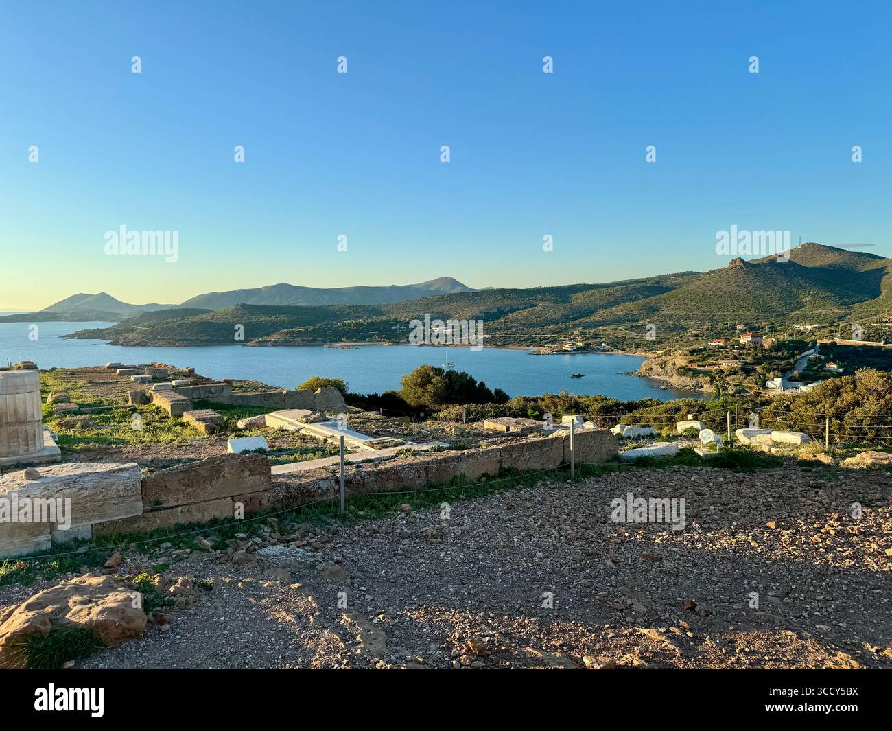Golden hour colors over the archaeological site of Sounion, with the Temple of Poseidon overlooking the Aegean Sea. - Smartphone Captured Stock Image