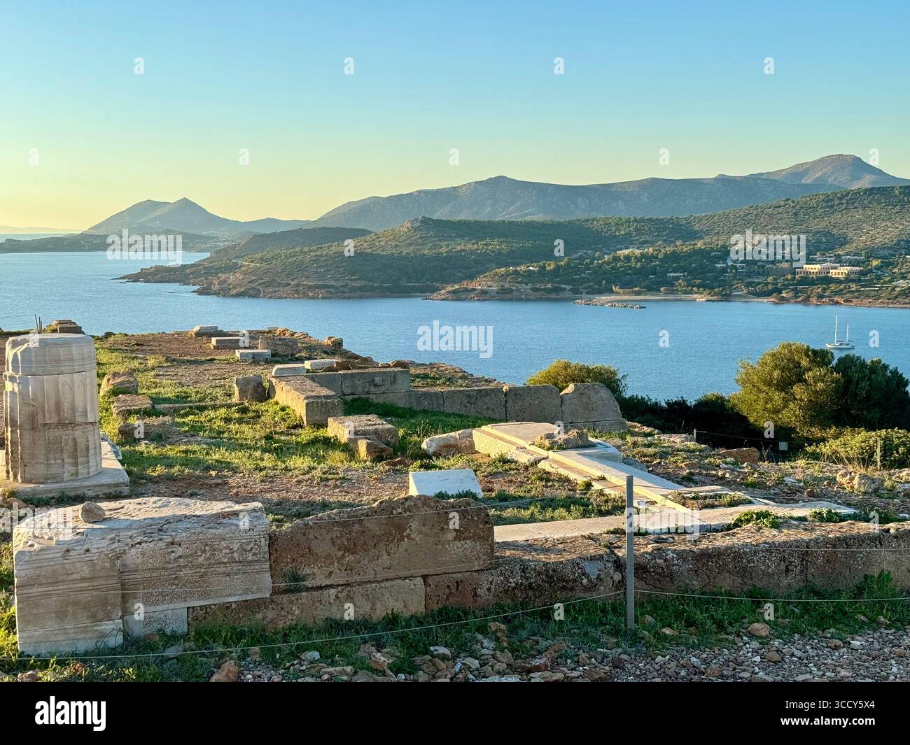 Golden hour colors over the archaeological site of Sounion, with the Temple of Poseidon overlooking the Aegean Sea. - Smartphone Captured Stock Image