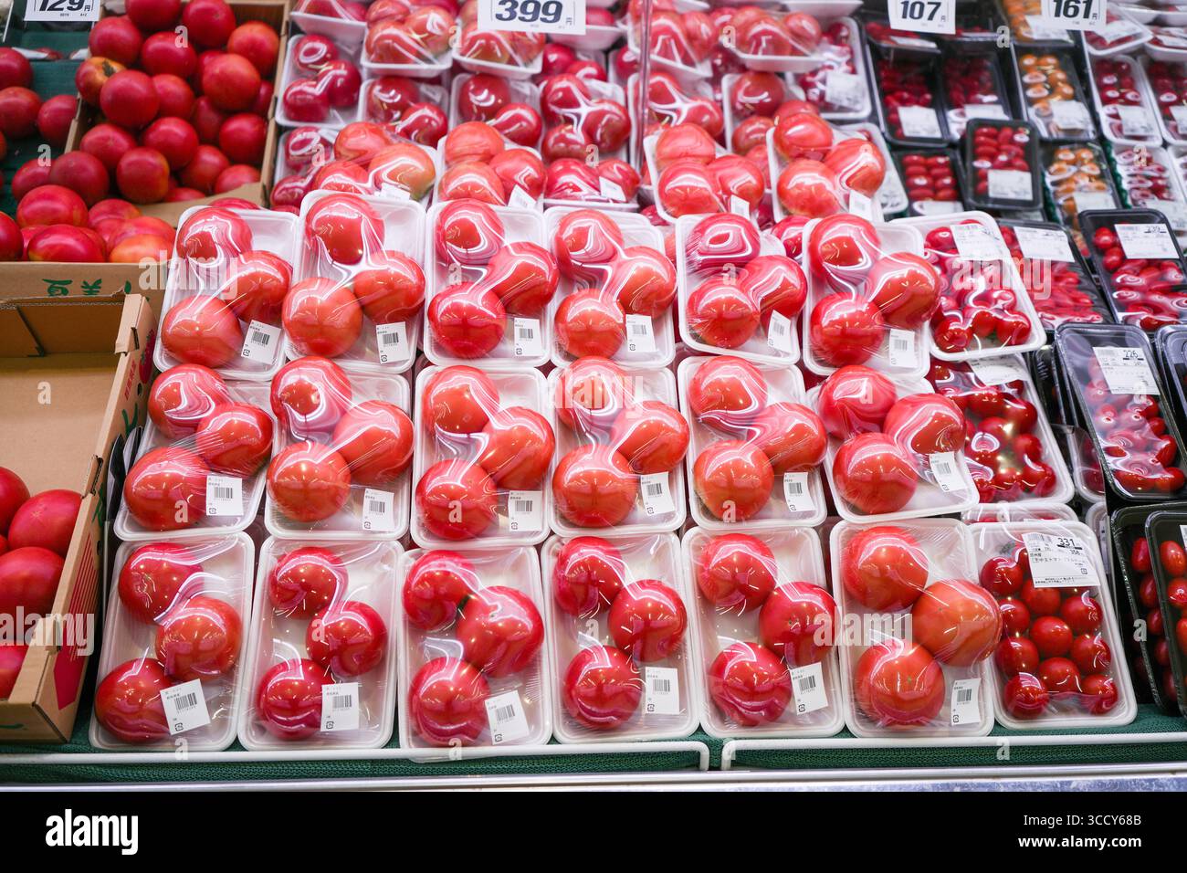 Packaged tomatoes in a supermarket in Japan. Stock Photo