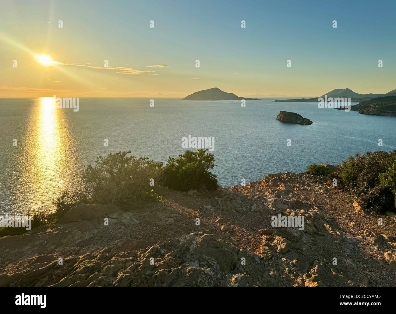 Golden hour sunset over the Aegean Sea at Cape Sounion near the Temple of Poseidon archaeological site. - Smartphone Captured Stock Image