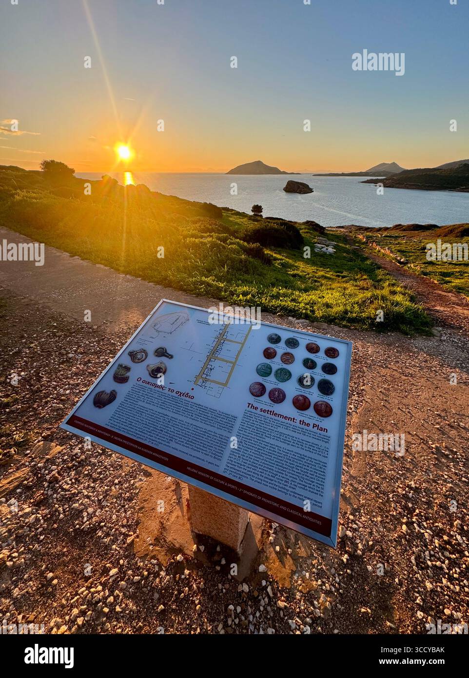 Informative board at golden hour lighting the archaeological site of Sounion, Greece, guiding tourists near the Temple of Poseidon. - Smartphone Captured Stock Image