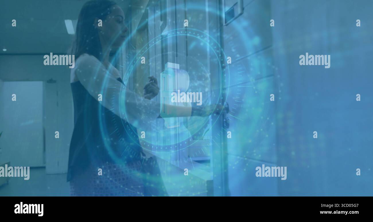 Scanning ID card, woman in black top using access reader in hallway with lockers, copy space Stock Photo