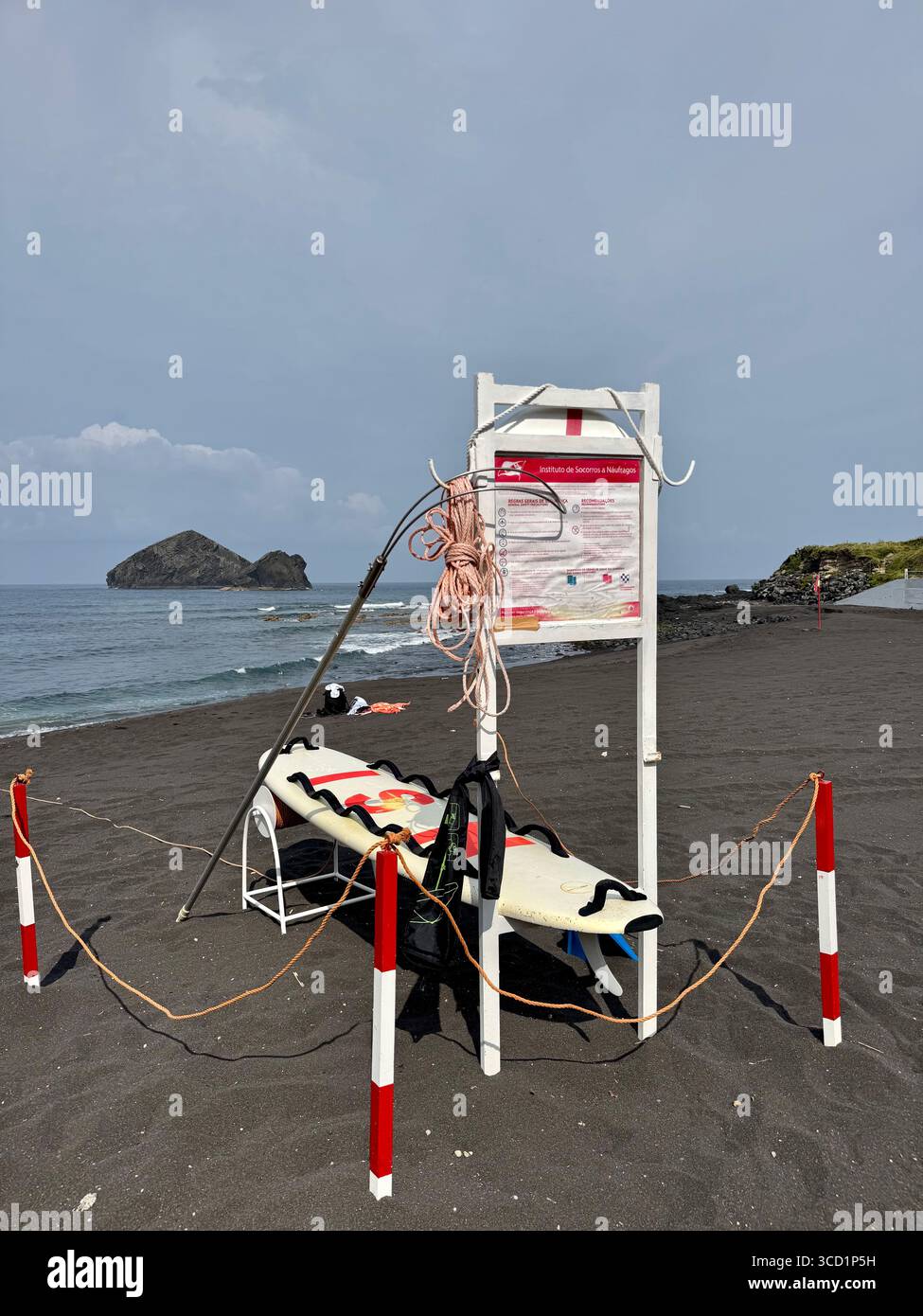Lifeguard rescue equipment and safety signage on Mosteiros Beach, Azores. - Smartphone Captured Stock Image