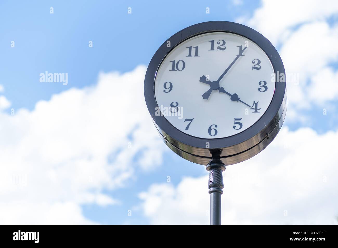 Pole mounted clock hi-res stock photography and images - Alamy