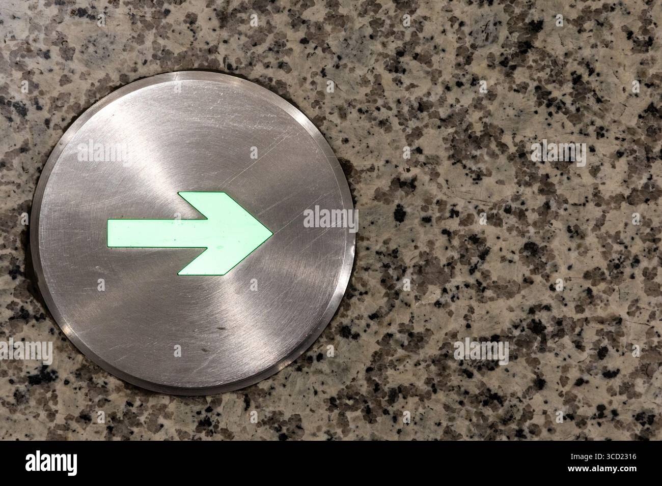 Indoor lighted directional arrow on floor pointing towards specific ...