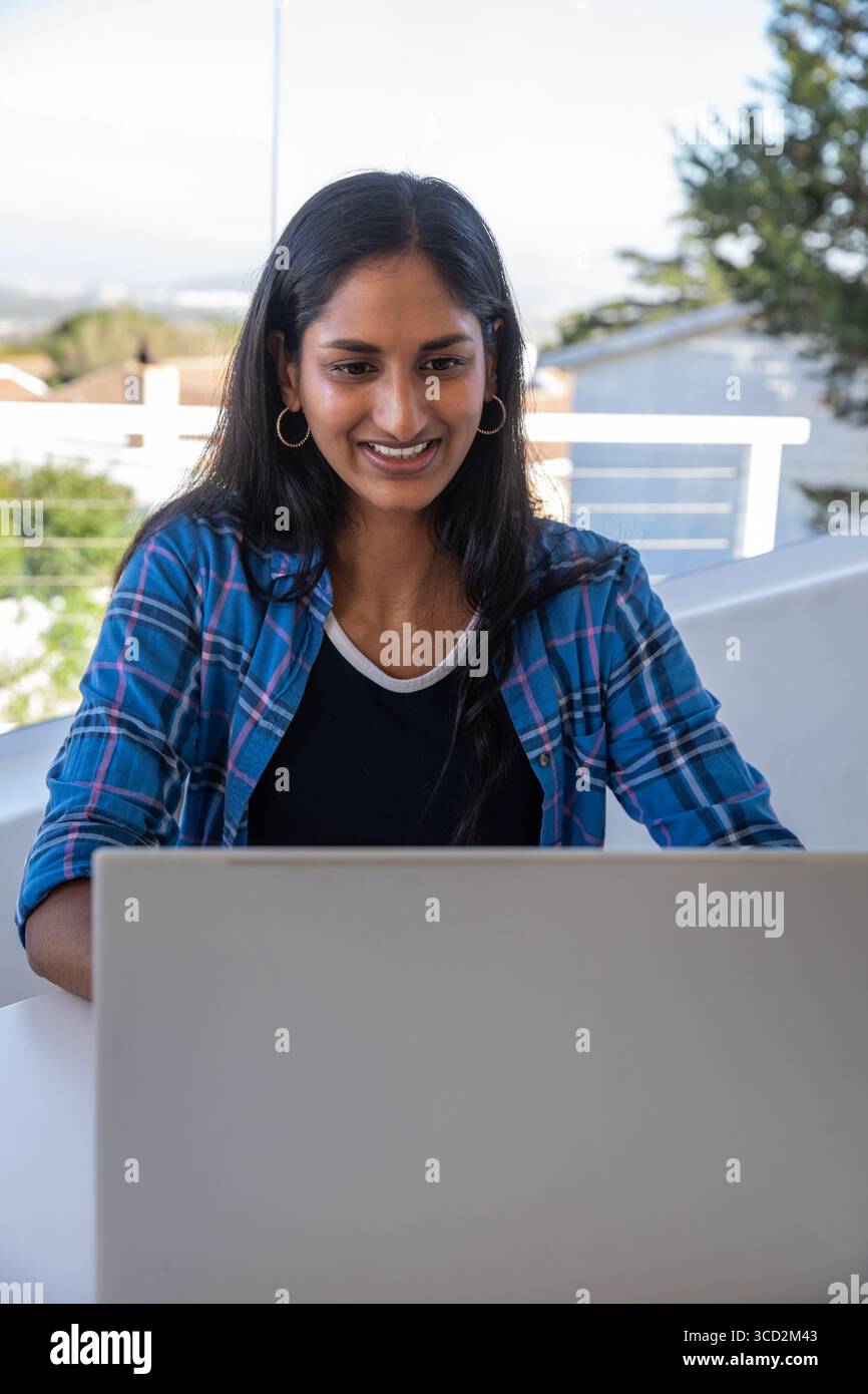 Young indian woman in blue shirt hi-res stock photography and images ...