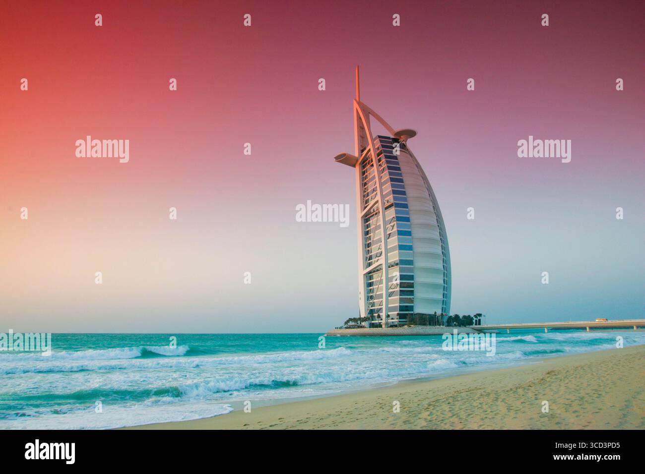 The iconic Burj Al Arab Hotel March 2005 rises above the coastline of Dubai, United Arab Emirates — a world-renowned symbol of luxury travel and exclusive hospitality. Framed by the turquoise waters of the Arabian Gulf, this sail-shaped architectural marvel offers visitors a glimpse into Dubai’s opulent lifestyle, making it a must-see destination for travellers and jet-setters from around the world. Stock Photo