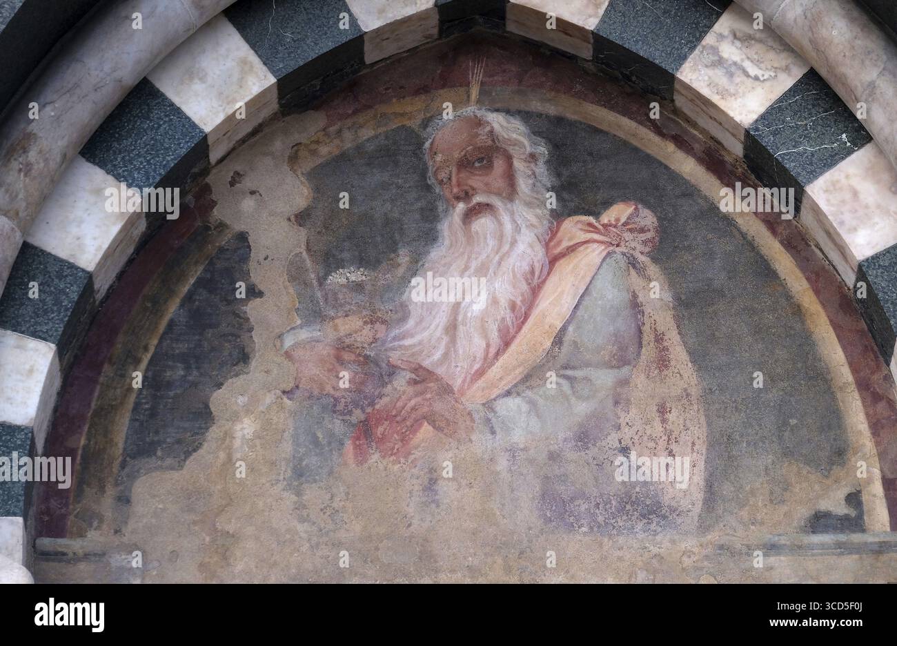 The lunette of one of the side doors depicting Aaron, detail of the facade of the Church of Santa Maria Novella in Florence, Italy Stock Photo