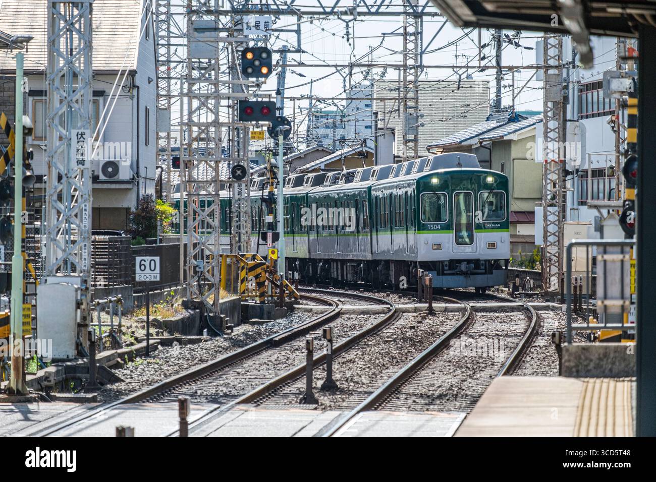 Keihan 2600 series train arriving at Fushimi-Inari Station, Fukakusa ...