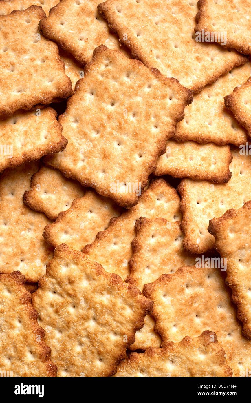 Homemade crispy crackers as background. Delicious salty crackers. Stock Photo