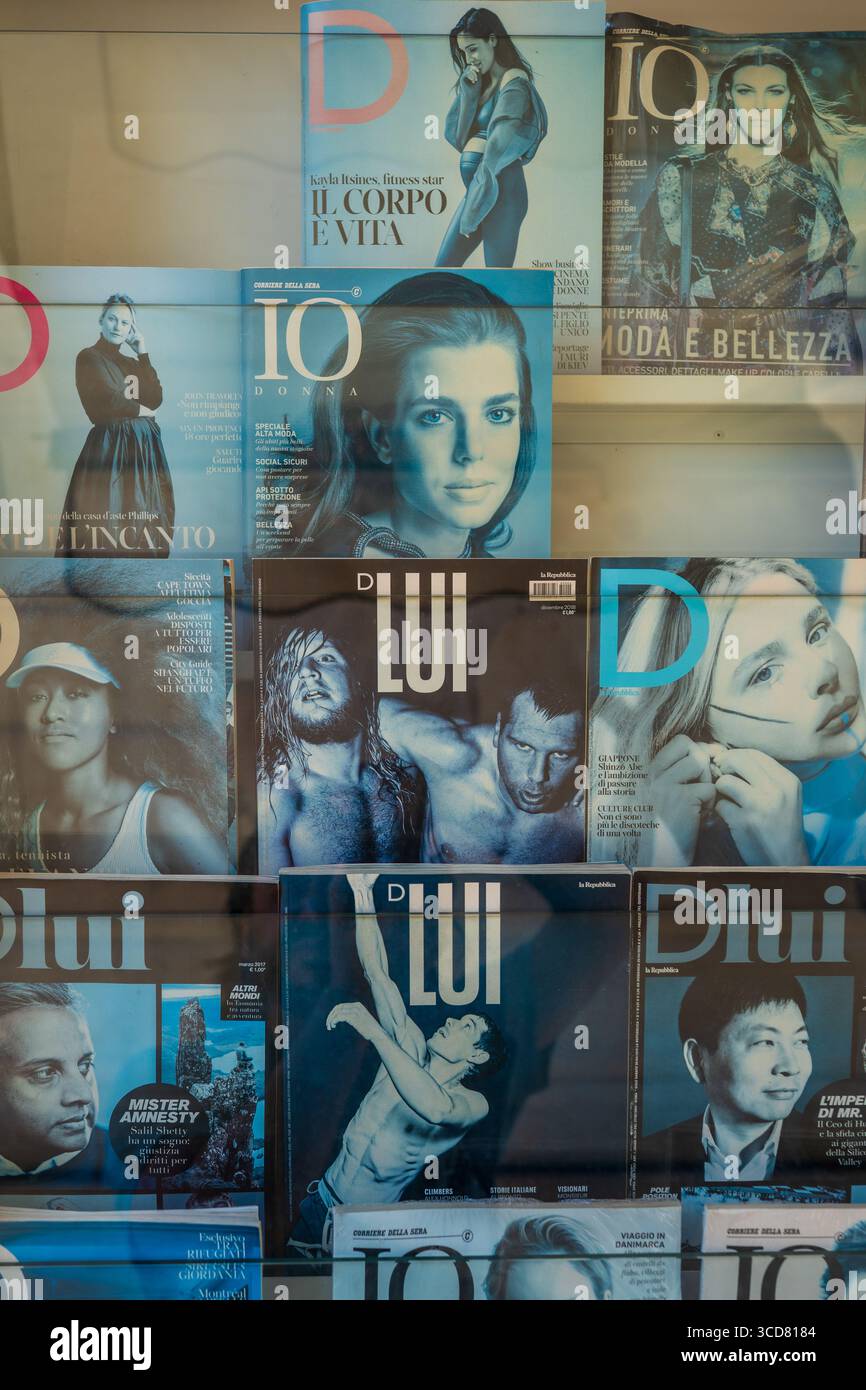 Old, faded Italian magazine covers at a newsstand, Lecce, Puglia, Italy Stock Photo