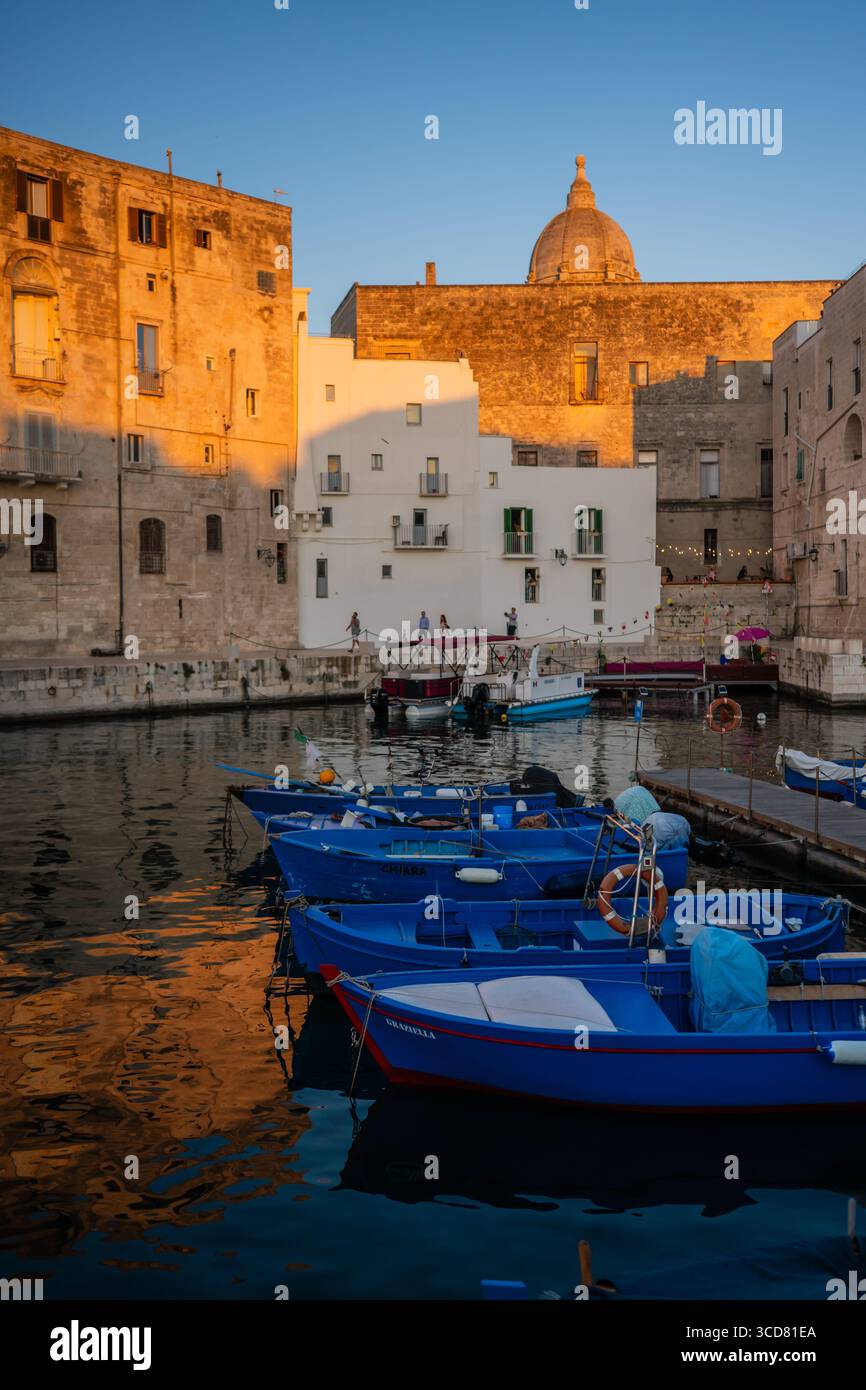 sunset-of-porto-antico-the-historic-old-port-of-monopoli-italy-stock
