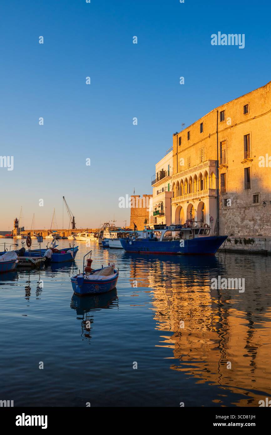 sunset-of-porto-antico-the-historic-old-port-of-monopoli-italy-stock