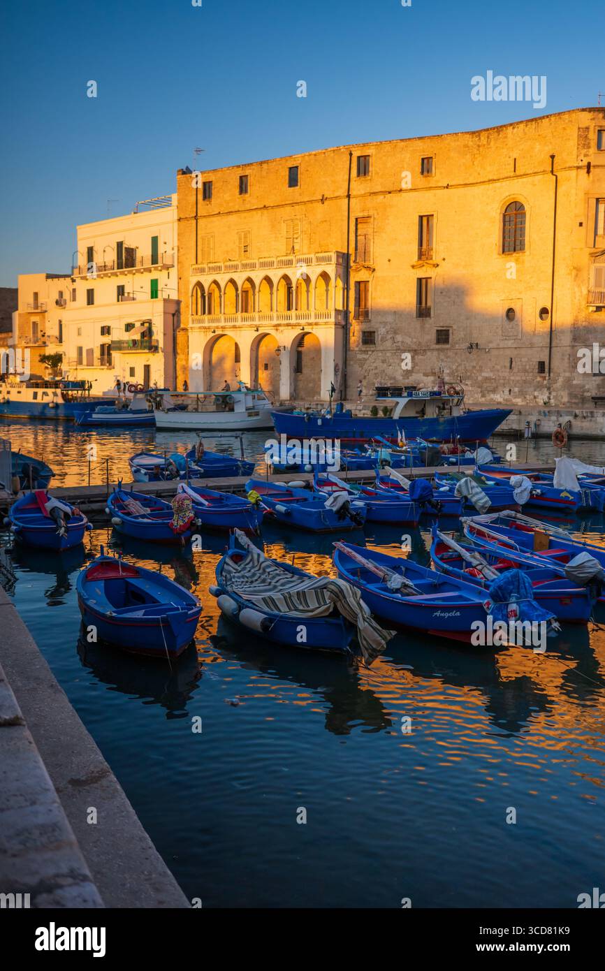 sunset-of-porto-antico-the-historic-old-port-of-monopoli-italy-stock