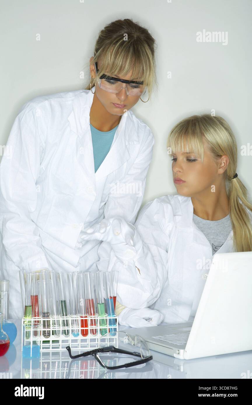 Female lab workers testing and experimenting Stock Photo