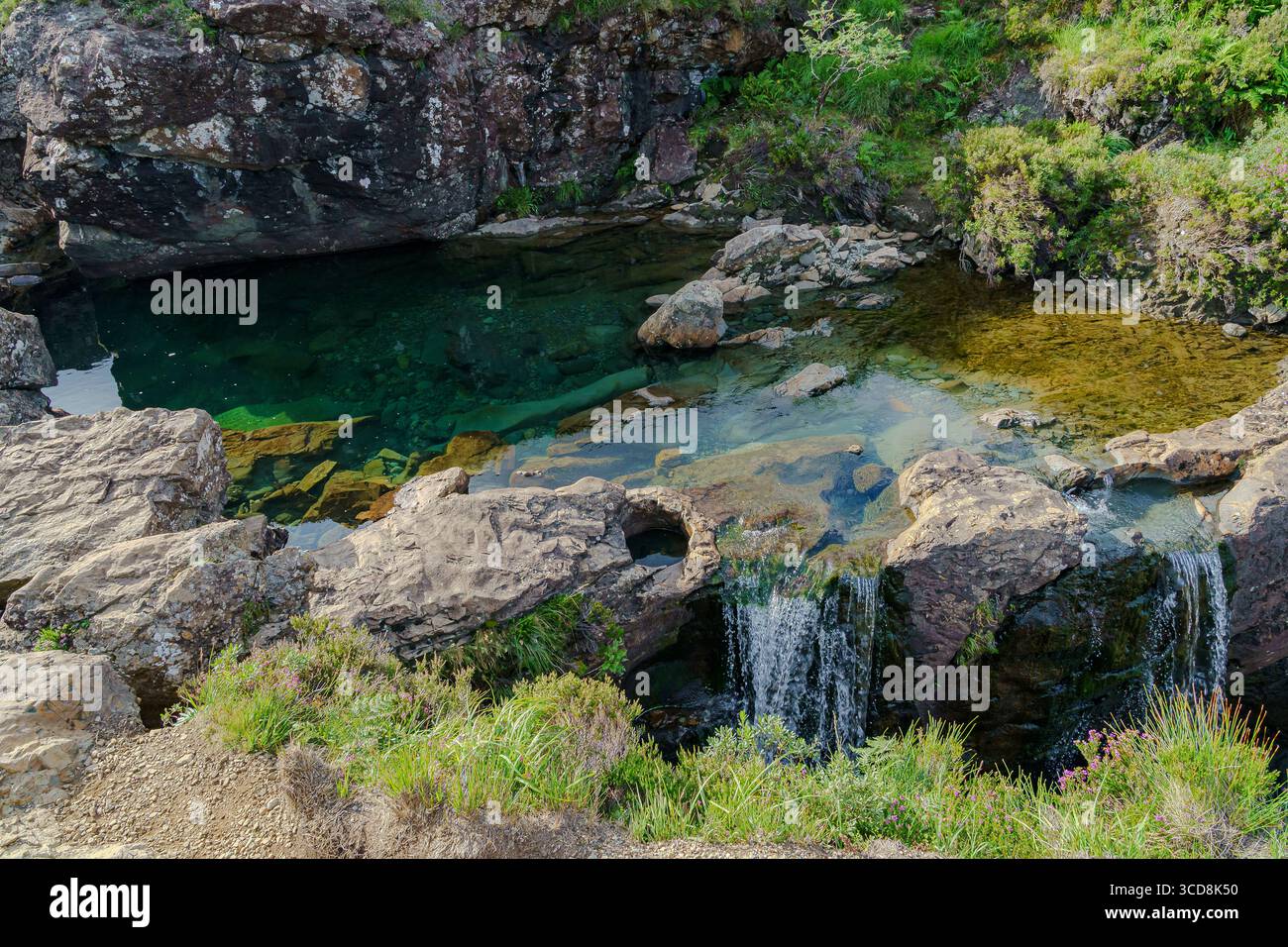 The crystal-clear Fairy Pools in Glen Brittle on the Isle of Skye, Scotland, with waterfalls and the Cuillin mountains in the background. Stock Photo