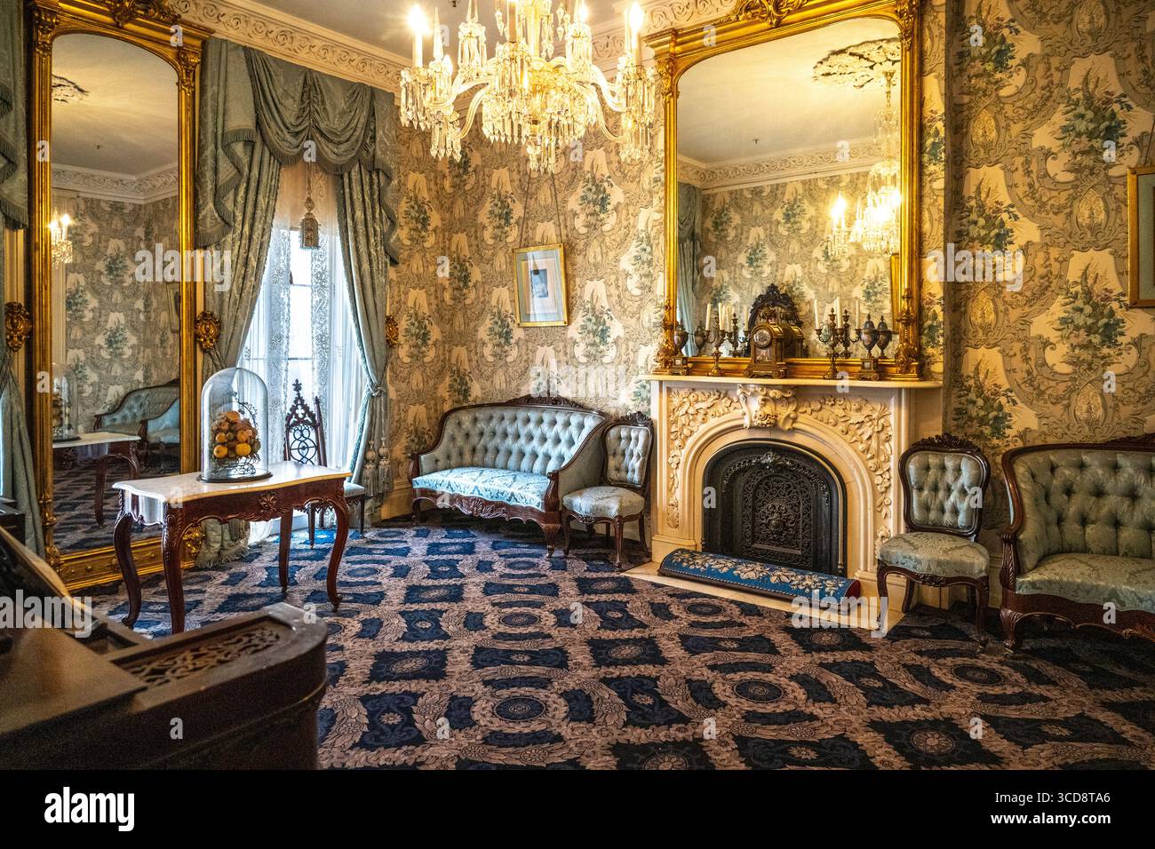 Sitting at fireplace in the parlor hi-res stock photography and