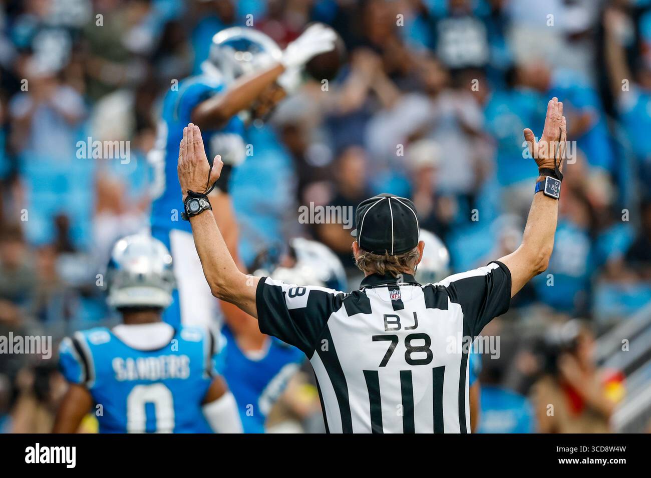 NFL back judge Greg Meyer (78) signals a touchdown during an NFL ...