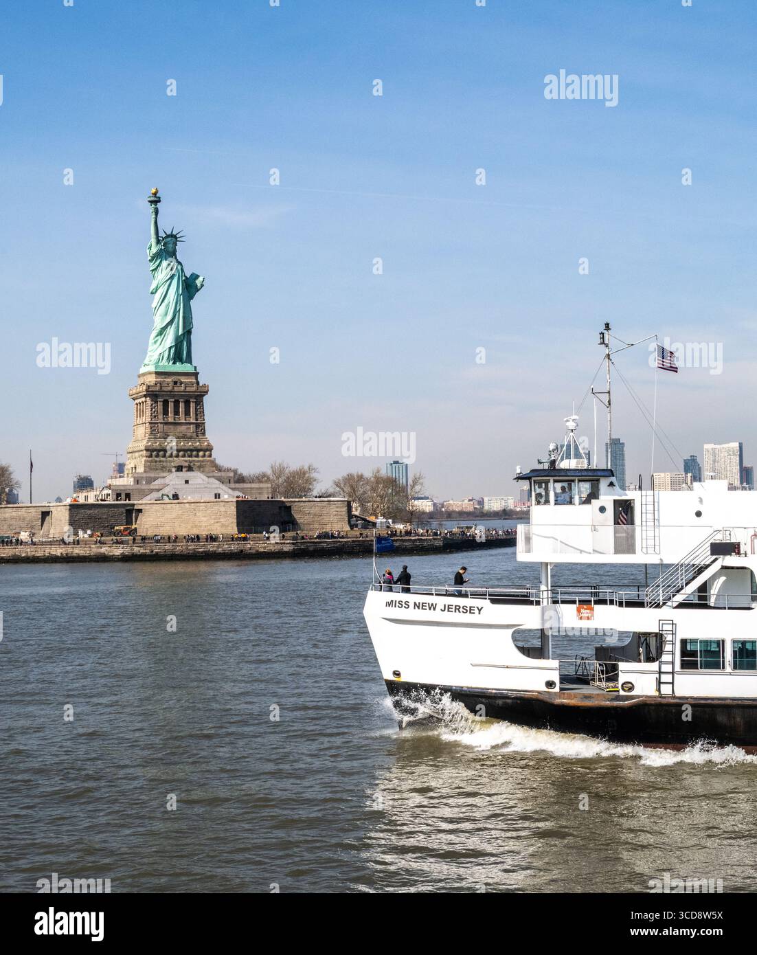 view of the Statue City Cruise boat and the Statue of Liberty in New York Habour Stock Photo