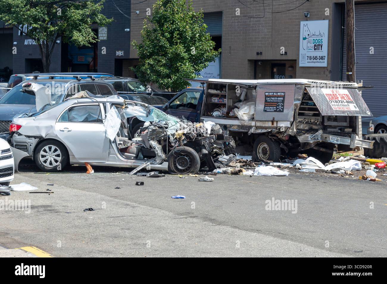 The damaged Toyota Corolla and coffee truck are seen at the scene of the crash were the driver and two pedestrians died in the Astoria neighborhood in the Queens borough of New York City. The crash happened on 19th Avenue and 42nd Street just after 8:30 a.m. The 84-year-old driver of a Toyota Corolla, who has not been identified, was taken to Elmhurst Hospital where he was pronounced dead. Investigators say two male pedestrians standing by the coffee truck, ages 41 and 70, were standing by the coffee truck and were struck. The 41-year-old was pronounced dead at the scene and the 70-year-old wa Stock Photo