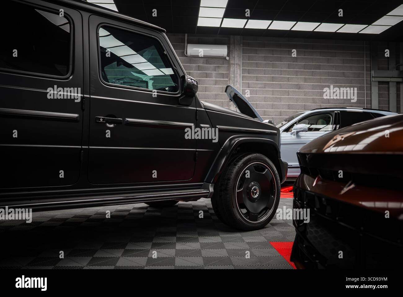 Black Mercedes AMG G Class and Ford Mustang GT 5.0 in Showroom Stock ...