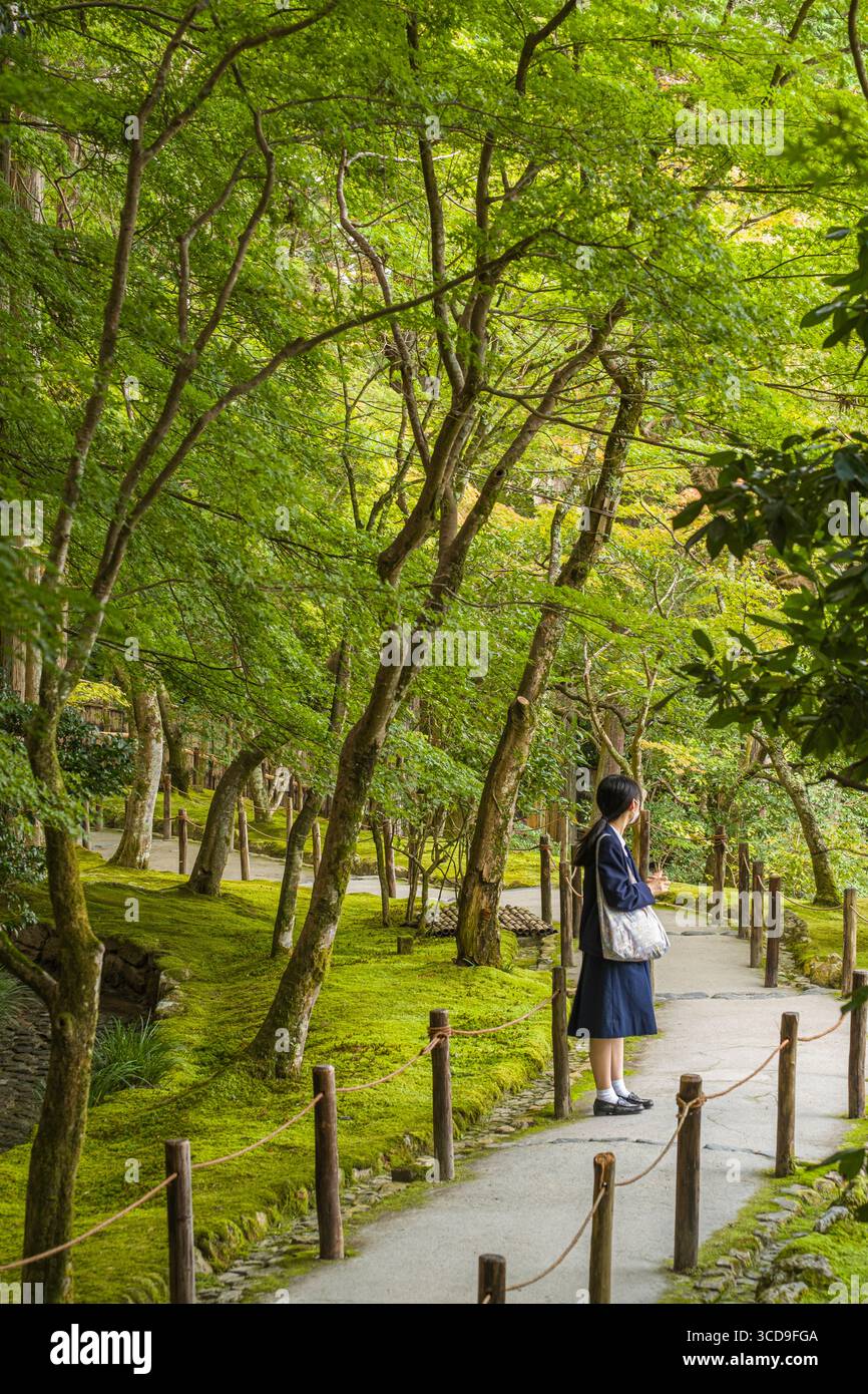 School girl in uniform standing on walking path in the upper garden at Higashiyama Jisho-ji, Ginkakujicho, Sakyo Ward, Kyoto, Kansai, Honshu, Japan Stock Photo