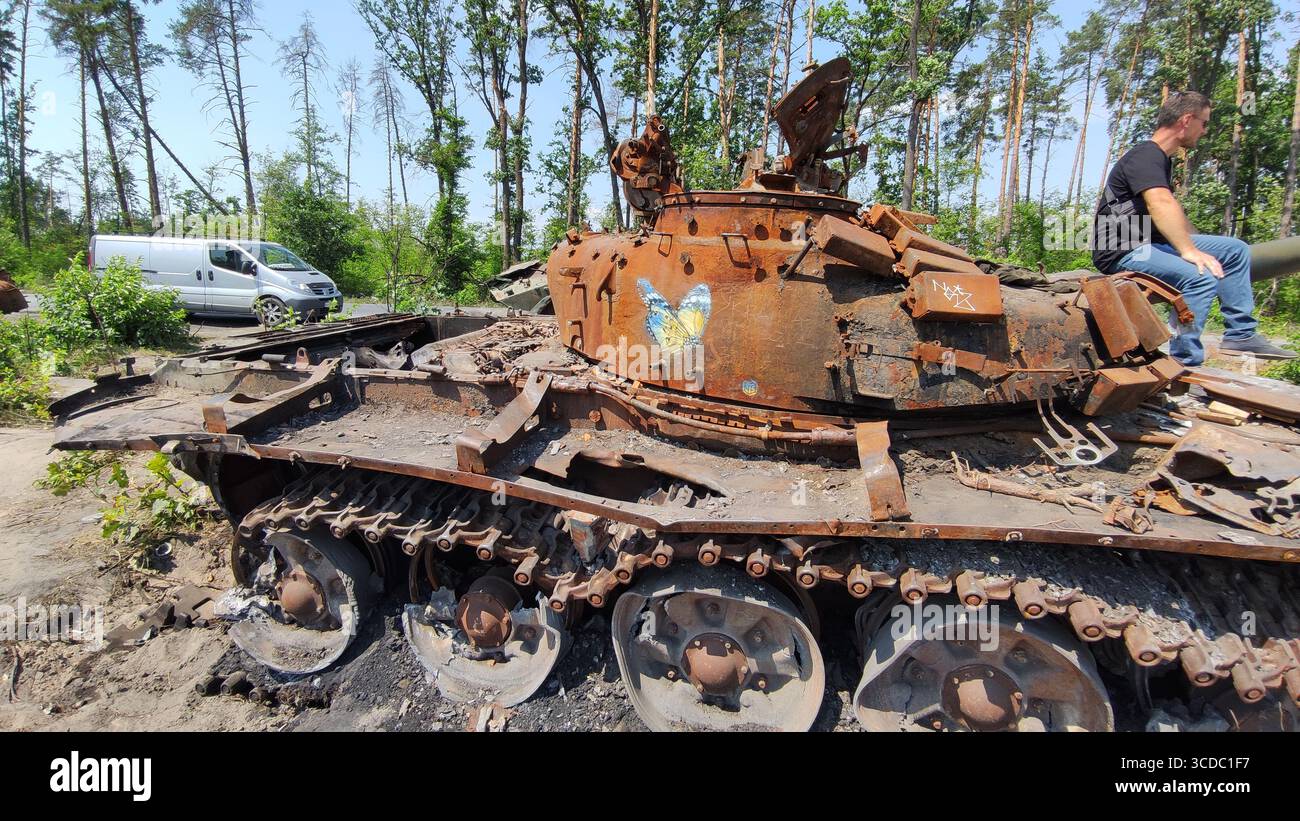Destroyed Russian Tank with Ukrainian Flag Artwork, Kyiv Region, March 2022 - Smartphone Captured Stock Image