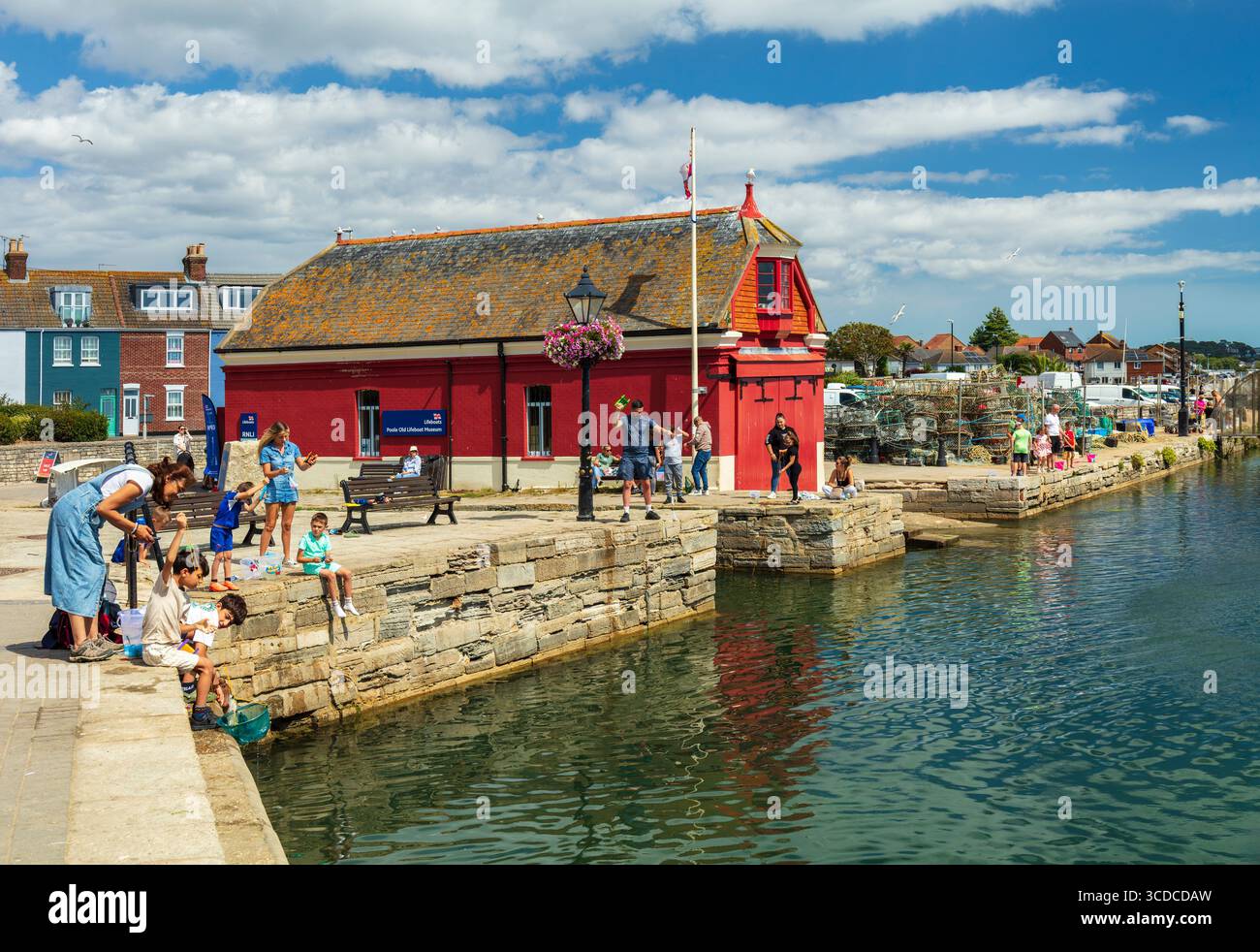 Old lifeboat museum and quayside scene Poole harbour. Stock Photo