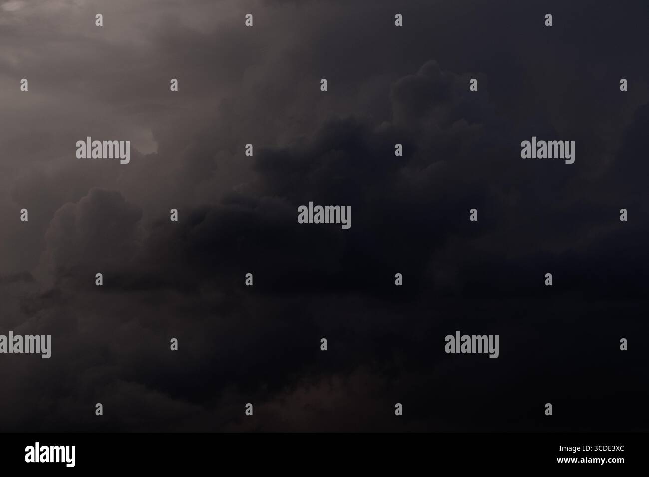 Dark storm clouds before thunderstorm. Dark sky background Stock Photo