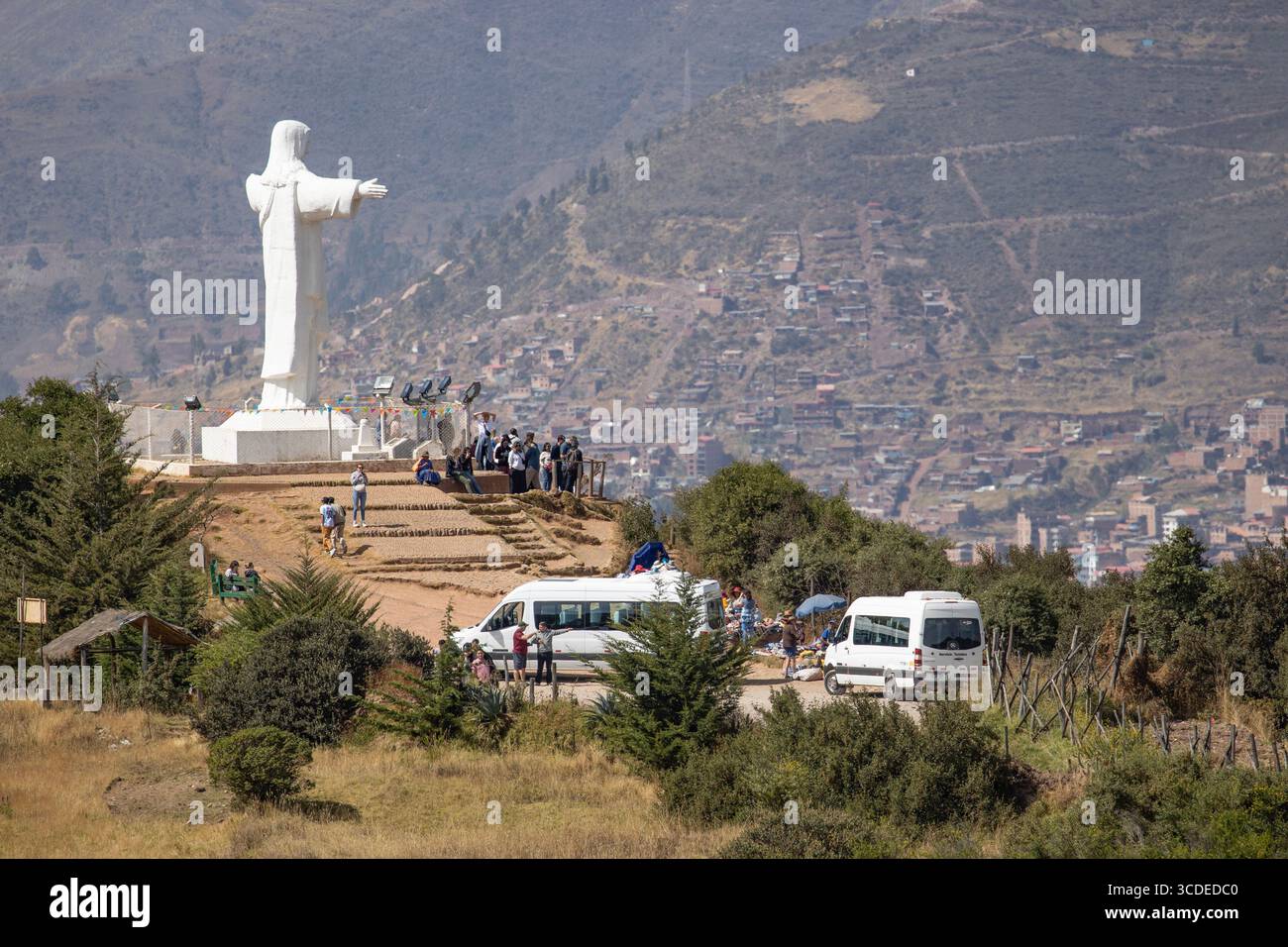 A large statue of Jesus, near the historical site at Saqsaywaman. a citadel on the outskirts of Cusco in Peru. Overlooking Cusco. Stock Photo