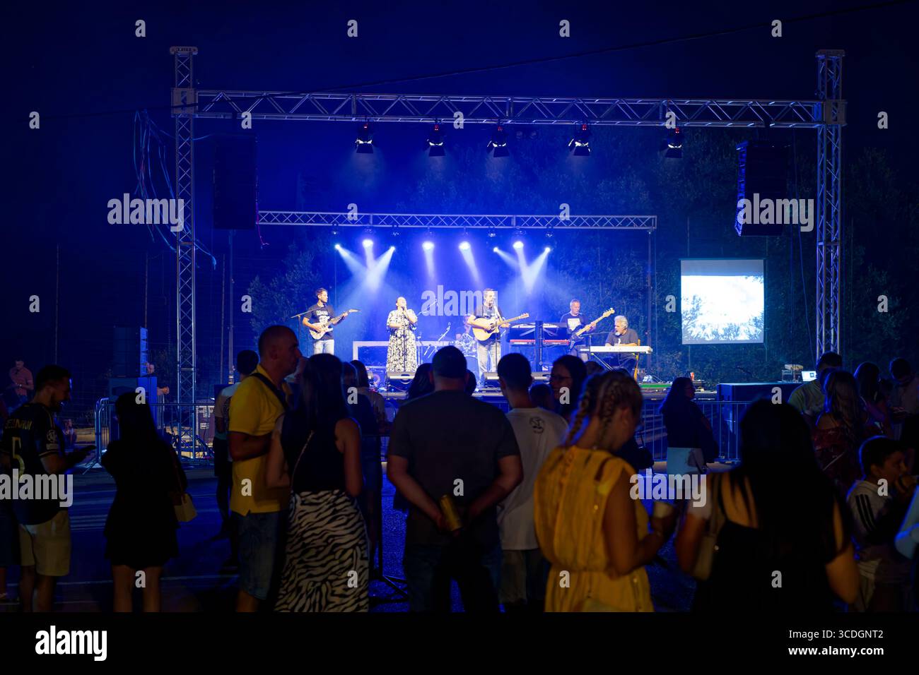Live music performance at Puhijada festival in Dol, Hvar island, Croatia, showing evening concert with stage lighting and audience Stock Photo